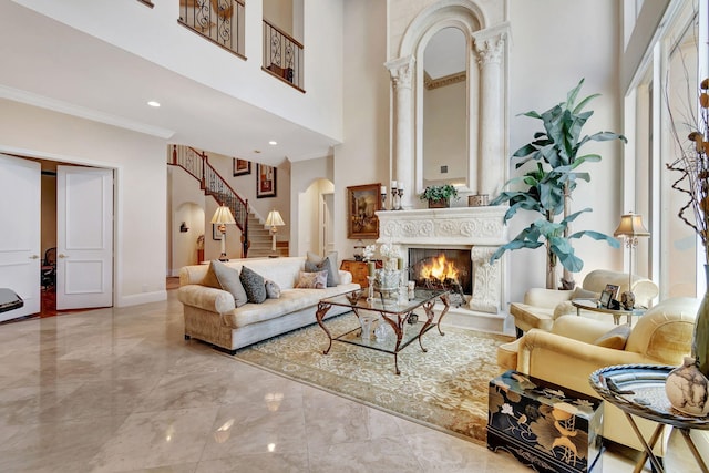6404 Dorsay Ct, Delray Beach, FL 33484 - living area featuring arched walkways, a high ceiling, marble tiled flooring, stairs, and a fireplace