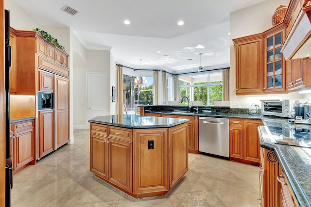 6404 Dorsay Ct, Delray Beach, FL 33484 - kitchen with dishwasher, a center island, brown cabinets, paneled refrigerator, and recessed lighting