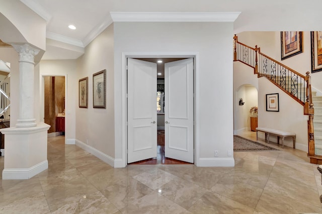 6404 Dorsay Ct, Delray Beach, FL 33484 - entryway featuring arched walkways, ornamental molding, stairs, decorative columns, and light marble finish flooring