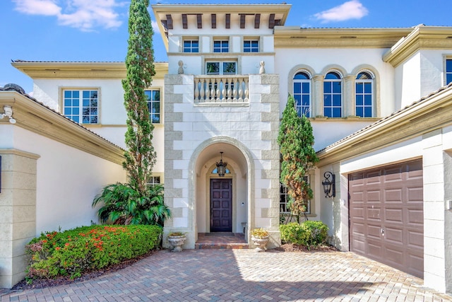 6404 Dorsay Ct, Delray Beach, FL 33484 - entrance to property with a garage, stucco siding, and decorative driveway