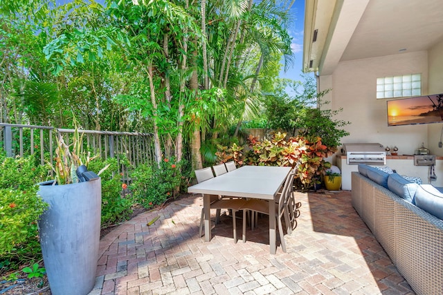 6404 Dorsay Ct, Delray Beach, FL 33484 - fenced backyard with exterior kitchen, outdoor dining area, and a patio area