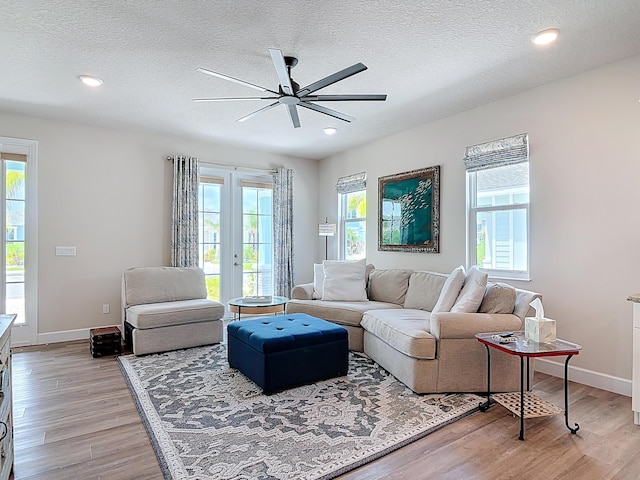 3121 Portofino Blvd, New Smyrna Beach, FL 32168 - living area with ceiling fan, light wood finished floors, a textured ceiling, and recessed lighting