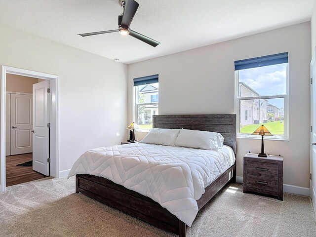 3121 Portofino Blvd, New Smyrna Beach, FL 32168 - bedroom with light carpet and a ceiling fan