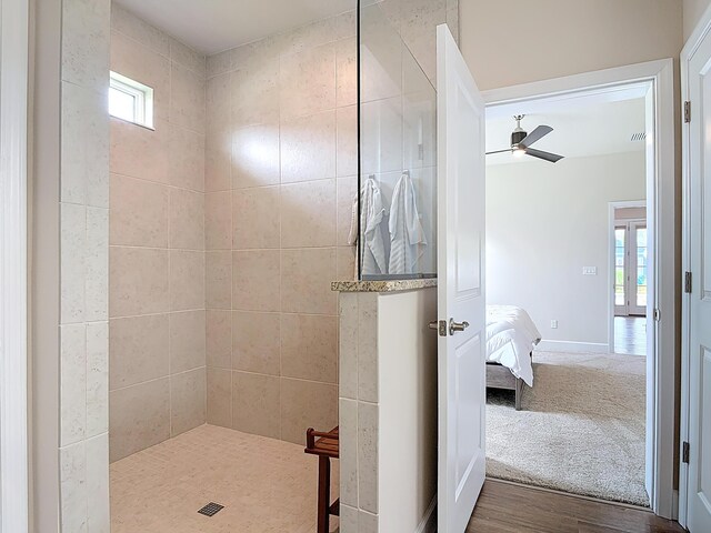 3121 Portofino Blvd, New Smyrna Beach, FL 32168 - ensuite bathroom featuring a walk in shower, a ceiling fan, and wood finished floors