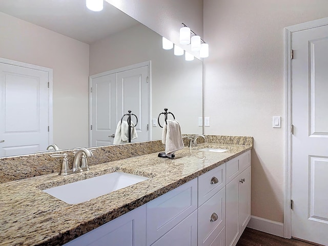 3121 Portofino Blvd, New Smyrna Beach, FL 32168 - bathroom featuring double vanity and wood finished floors