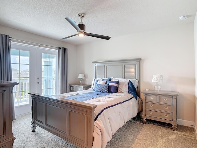 3121 Portofino Blvd, New Smyrna Beach, FL 32168 - bedroom with light colored carpet, access to outside, ceiling fan, french doors, and a textured ceiling