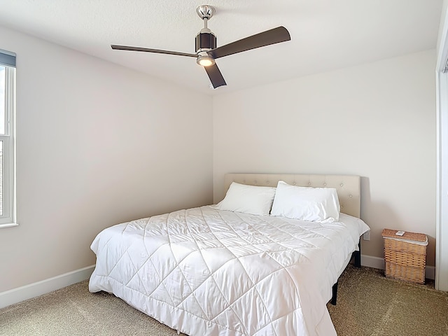 3121 Portofino Blvd, New Smyrna Beach, FL 32168 - carpeted bedroom with baseboards and ceiling fan