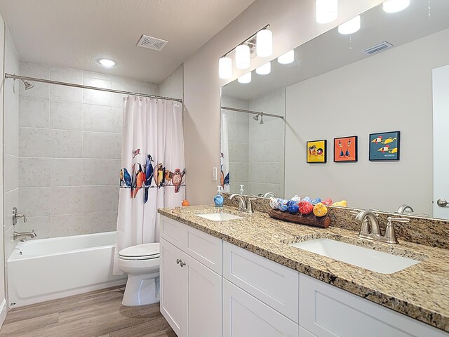 3121 Portofino Blvd, New Smyrna Beach, FL 32168 - bathroom with wood finished floors, shower / bath combo, and double vanity