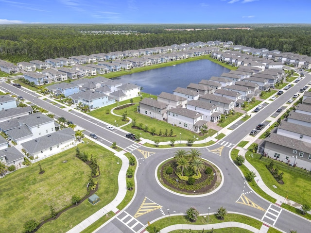 3121 Portofino Blvd, New Smyrna Beach, FL 32168 - aerial view of residential area featuring a heavily wooded area and a large body of water