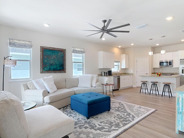 3121 Portofino Blvd, New Smyrna Beach, FL 32168 - living area featuring ceiling fan, light wood-style flooring, and recessed lighting