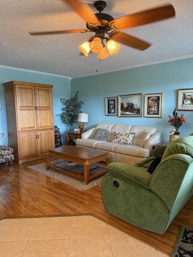 3007 Yarmouth Unit A, Boca Raton, FL 33434 - living room featuring a textured ceiling, ceiling fan, ornamental molding, and light tile patterned floors