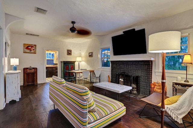 312 Central Dr, West Palm Beach, FL 33405 - living area with a fireplace, wood-type flooring, and a ceiling fan