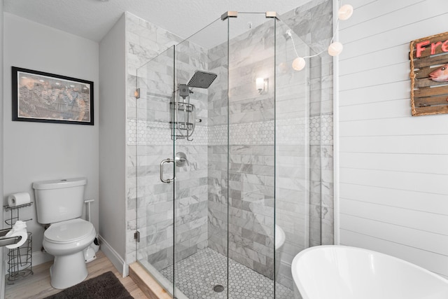 2051 SW Pruitt St, Port Saint Lucie, FL 34953 - bathroom with a freestanding tub, a shower stall, and wood finished floors