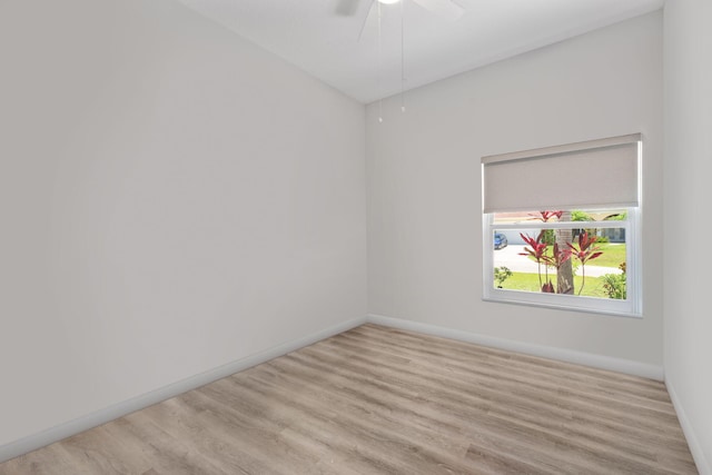 2051 SW Pruitt St, Port Saint Lucie, FL 34953 - spare room with wood finished floors and a ceiling fan