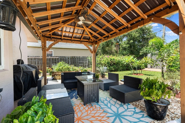 2051 SW Pruitt St, Port Saint Lucie, FL 34953 - fenced backyard with outdoor lounge area, a gazebo, and area for grilling