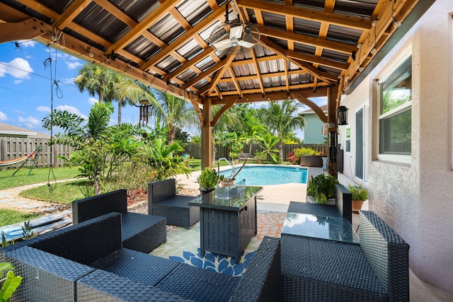 2051 SW Pruitt St, Port Saint Lucie, FL 34953 - fenced backyard featuring a patio, outdoor lounge area, and a gazebo