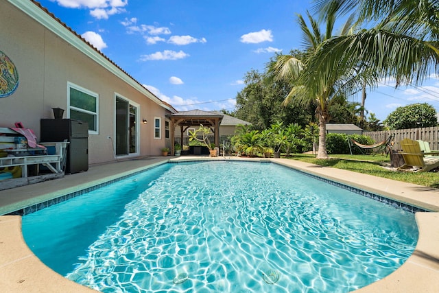 2051 SW Pruitt St, Port Saint Lucie, FL 34953 - view of pool with a gazebo and a patio