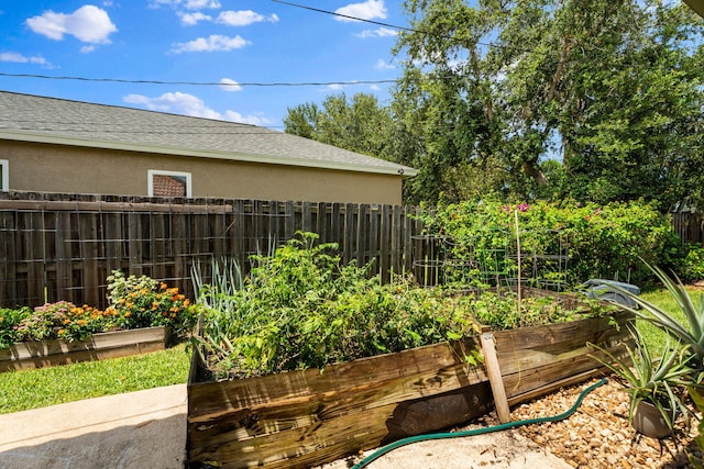 2051 SW Pruitt St, Port Saint Lucie, FL 34953 - view of yard with a vegetable garden