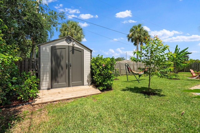 2051 SW Pruitt St, Port Saint Lucie, FL 34953 - fenced backyard featuring a storage shed