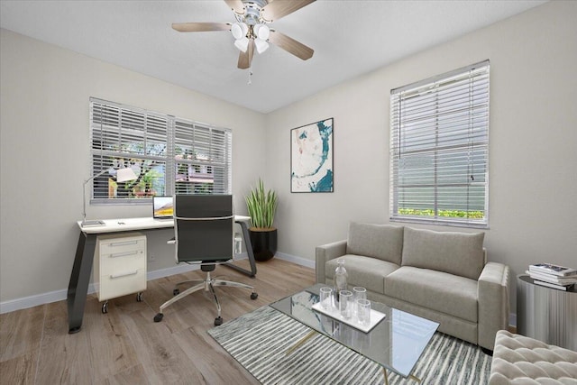 615 Castle Dr, Palm Beach Gardens, FL 33410 - home office with ceiling fan, wood finished floors, and healthy amount of natural light