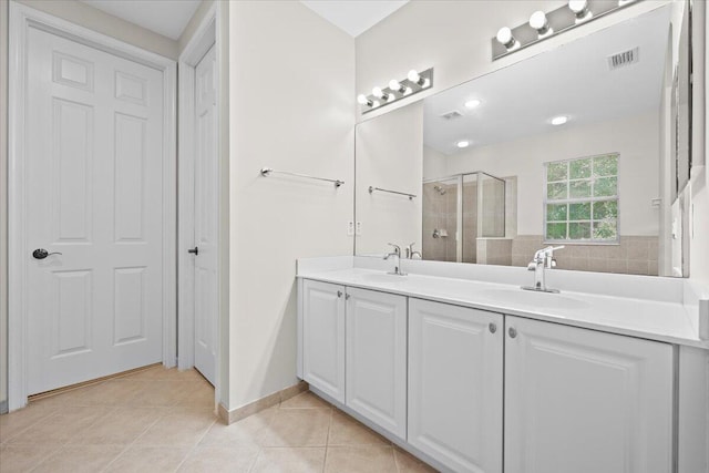 615 Castle Dr, Palm Beach Gardens, FL 33410 - full bathroom featuring double vanity, a stall shower, and tile patterned flooring