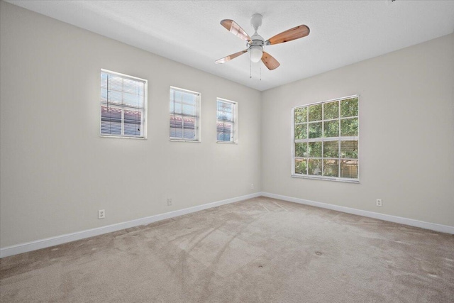 615 Castle Dr, Palm Beach Gardens, FL 33410 - spare room featuring light carpet and a ceiling fan
