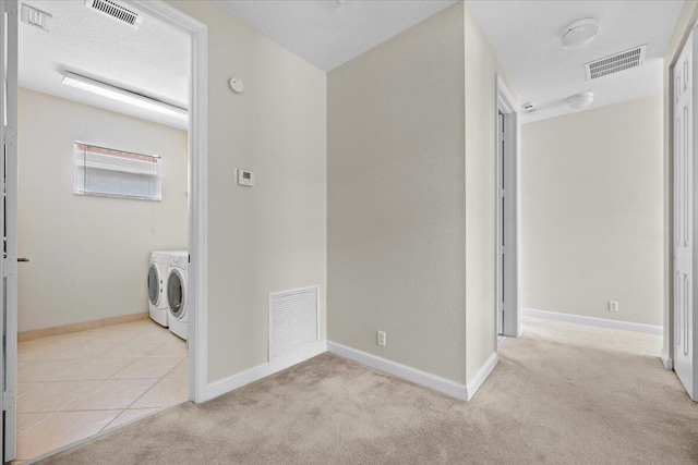 615 Castle Dr, Palm Beach Gardens, FL 33410 - washroom featuring washer and clothes dryer and light colored carpet