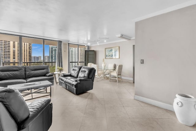 19667 Turnberry Way Unit 10C, Aventura, FL 33180 - living area with rail lighting, light tile patterned floors, crown molding, expansive windows, and a city view