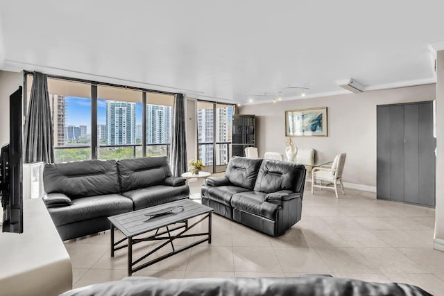 19667 Turnberry Way Unit 10C, Aventura, FL 33180 - living room featuring light tile patterned flooring, rail lighting, a view of city, and crown molding