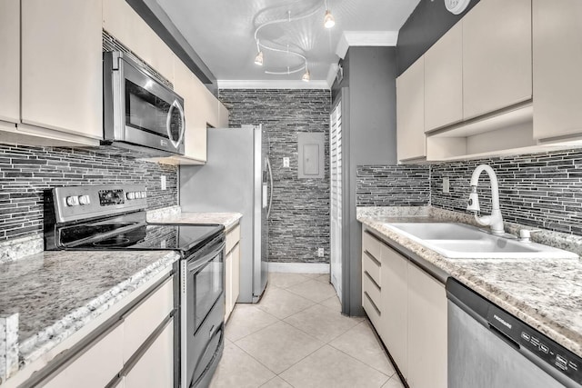 19667 Turnberry Way Unit 10C, Aventura, FL 33180 - kitchen featuring stainless steel appliances, ornamental molding, light tile patterned flooring, and decorative backsplash