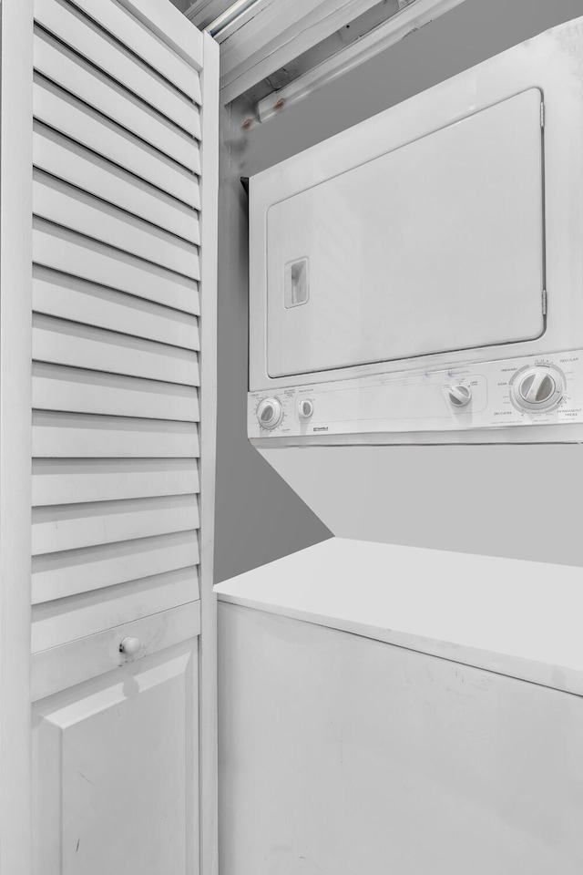 19667 Turnberry Way Unit 10C, Aventura, FL 33180 - washroom with stacked washer and clothes dryer
