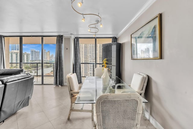 19667 Turnberry Way Unit 10C, Aventura, FL 33180 - dining area featuring crown molding, tile patterned floors, and floor to ceiling windows