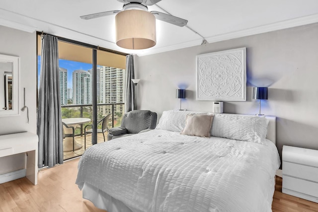 19667 Turnberry Way Unit 10C, Aventura, FL 33180 - bedroom featuring crown molding, wood finished floors, a ceiling fan, and access to outside