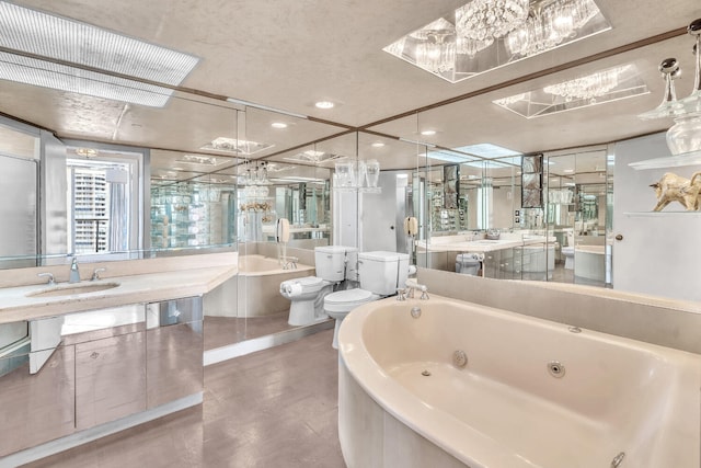 19667 Turnberry Way Unit 10C, Aventura, FL 33180 - full bath with a jetted tub, a chandelier, vanity, a bidet, and recessed lighting