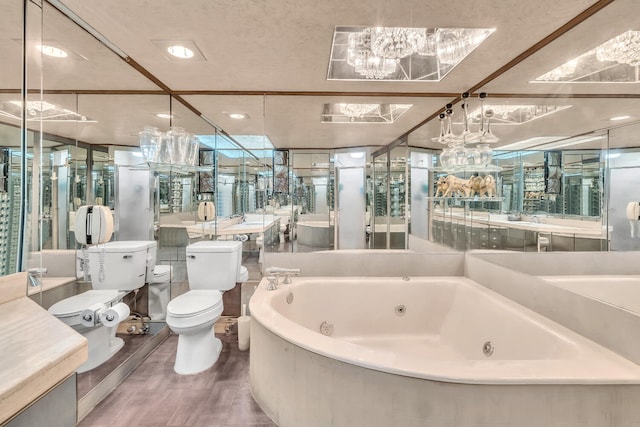 19667 Turnberry Way Unit 10C, Aventura, FL 33180 - bathroom featuring a jetted tub and vanity