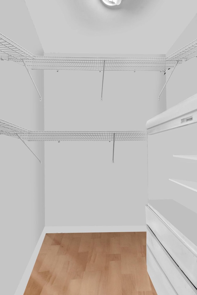 19667 Turnberry Way Unit 10C, Aventura, FL 33180 - walk in closet with light wood-style flooring