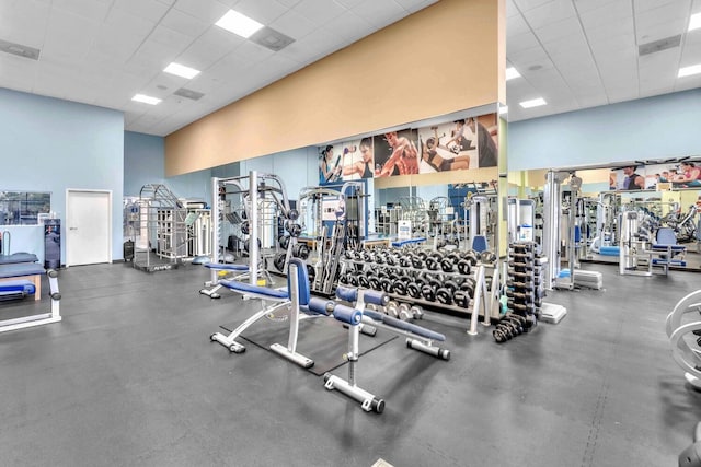 19667 Turnberry Way Unit 10C, Aventura, FL 33180 - workout area featuring a paneled ceiling and a towering ceiling