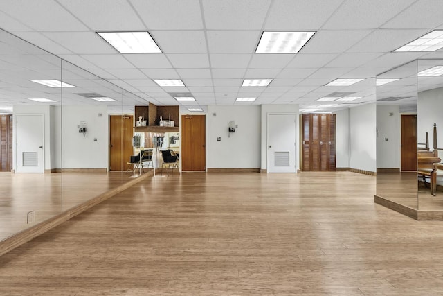 19667 Turnberry Way Unit 10C, Aventura, FL 33180 - exercise area featuring light wood-style floors and a paneled ceiling