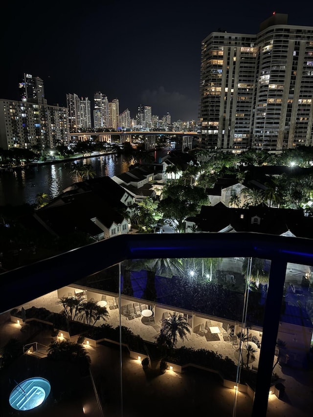 19667 Turnberry Way Unit 10C, Aventura, FL 33180 - pool at twilight with a view of city lights and a water view
