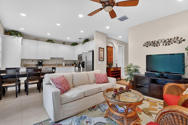 7271 Briella Dr, Boynton Beach, FL 33437 - living area with ceiling fan, recessed lighting, light tile patterned flooring, and arched walkways