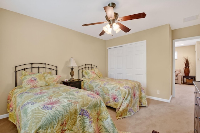 7271 Briella Dr, Boynton Beach, FL 33437 - bedroom featuring light colored carpet, a closet, and a ceiling fan