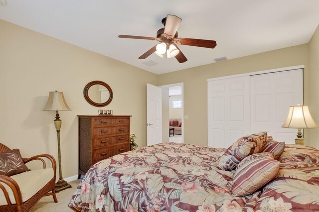 7271 Briella Dr, Boynton Beach, FL 33437 - bedroom with light carpet, a closet, and a ceiling fan