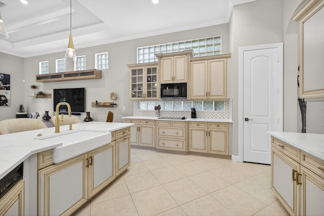 8168 Valhalla Dr, Delray Beach, FL 33446 - kitchen with cream cabinetry, black appliances, decorative backsplash, crown molding, and recessed lighting