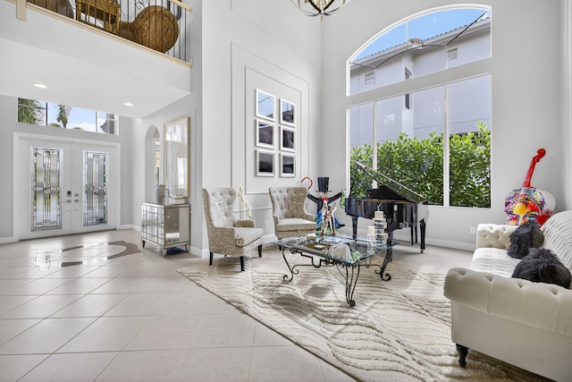 8168 Valhalla Dr, Delray Beach, FL 33446 - living area featuring a high ceiling, french doors, tile patterned flooring, and arched walkways