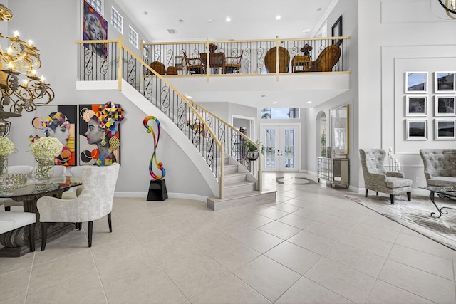 8168 Valhalla Dr, Delray Beach, FL 33446 - tiled entrance foyer with a chandelier, stairs, a towering ceiling, recessed lighting, and arched walkways