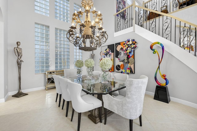 8168 Valhalla Dr, Delray Beach, FL 33446 - tiled dining room with a chandelier, healthy amount of natural light, a towering ceiling, and stairs