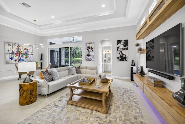 8168 Valhalla Dr, Delray Beach, FL 33446 - living area with a raised ceiling, arched walkways, light tile patterned floors, ceiling fan, and crown molding
