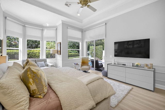 8168 Valhalla Dr, Delray Beach, FL 33446 - bedroom featuring multiple windows, crown molding, wood finished floors, access to exterior, and a raised ceiling