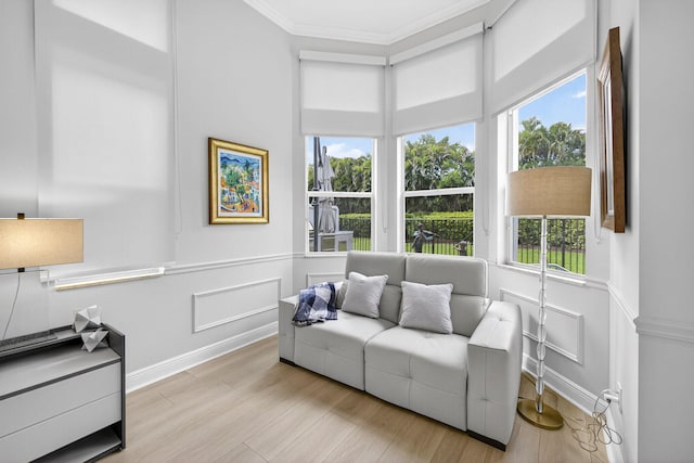 8168 Valhalla Dr, Delray Beach, FL 33446 - sitting room with crown molding, wood finished floors, wainscoting, and a decorative wall