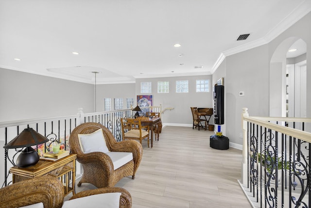 8168 Valhalla Dr, Delray Beach, FL 33446 - sitting room with ornamental molding, recessed lighting, light wood-style flooring, arched walkways, and an upstairs landing